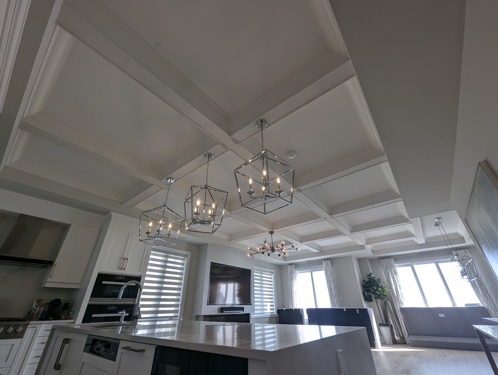 Coffered ceiling install in a Toronto living room with recessed panel grid pattern