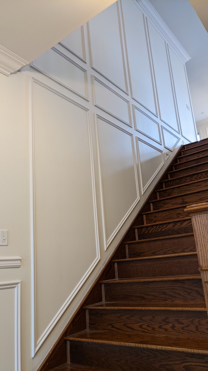 Picture-frame wainscoting with two-tone staircase, Vaughan-area install