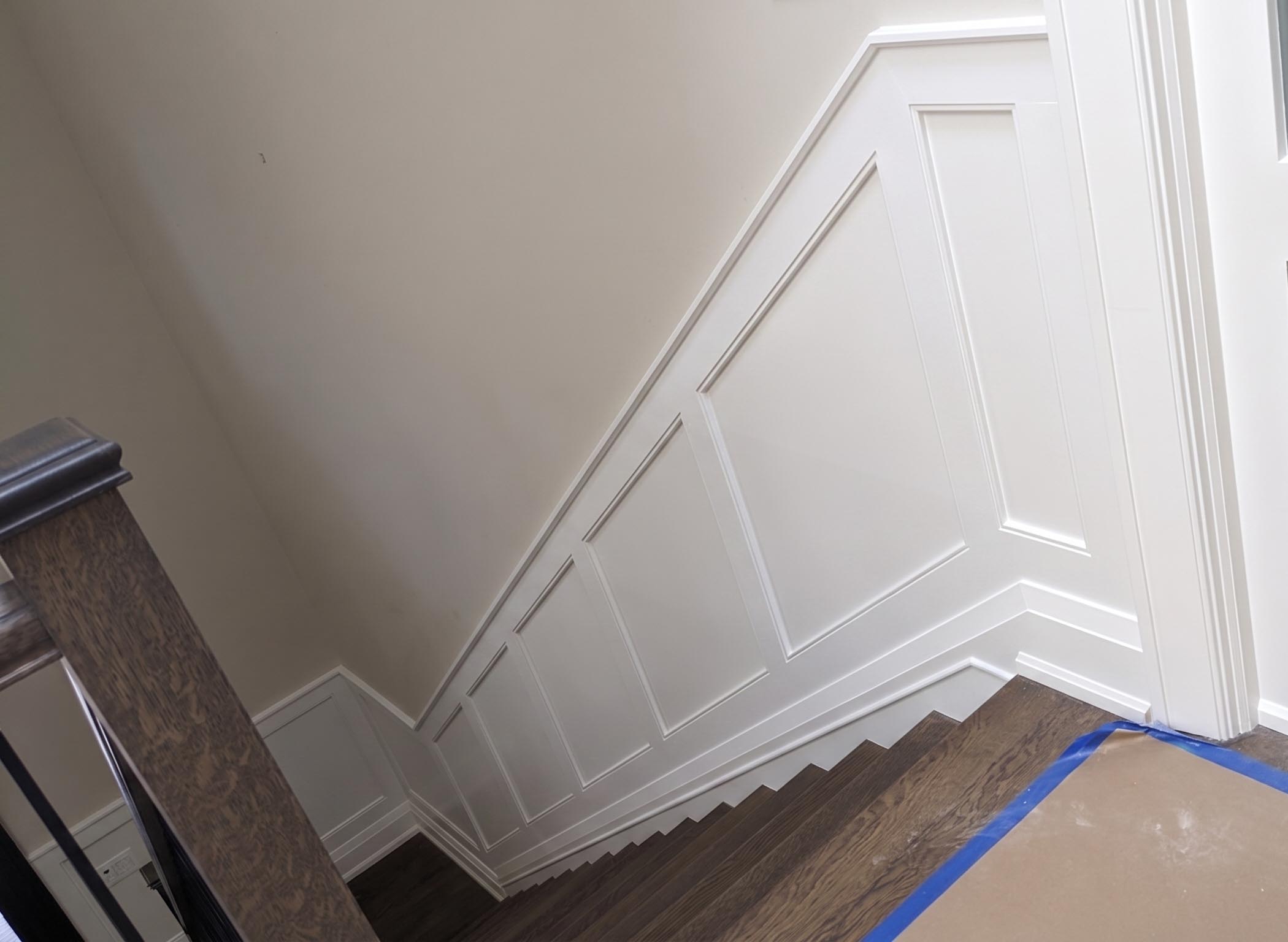 Shaker wainscoting panelling on a staircase by Expert Crown Moulding