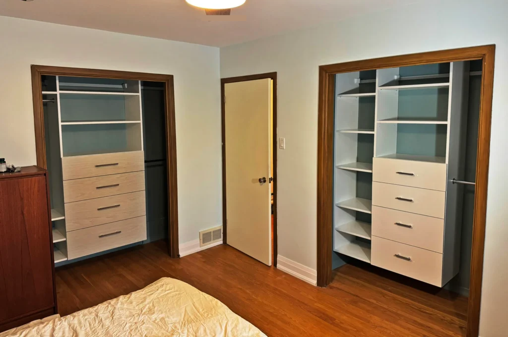 Reach-in closet organizer with double-hang, shelving, and drawer bank in a Toronto bedroom