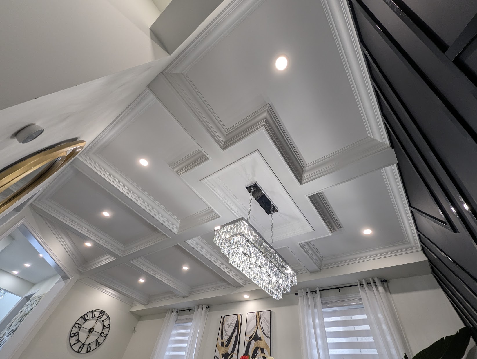 Coffered ceiling, feature wall and crown moulding by Expert Crown Moulding in a Toronto condo