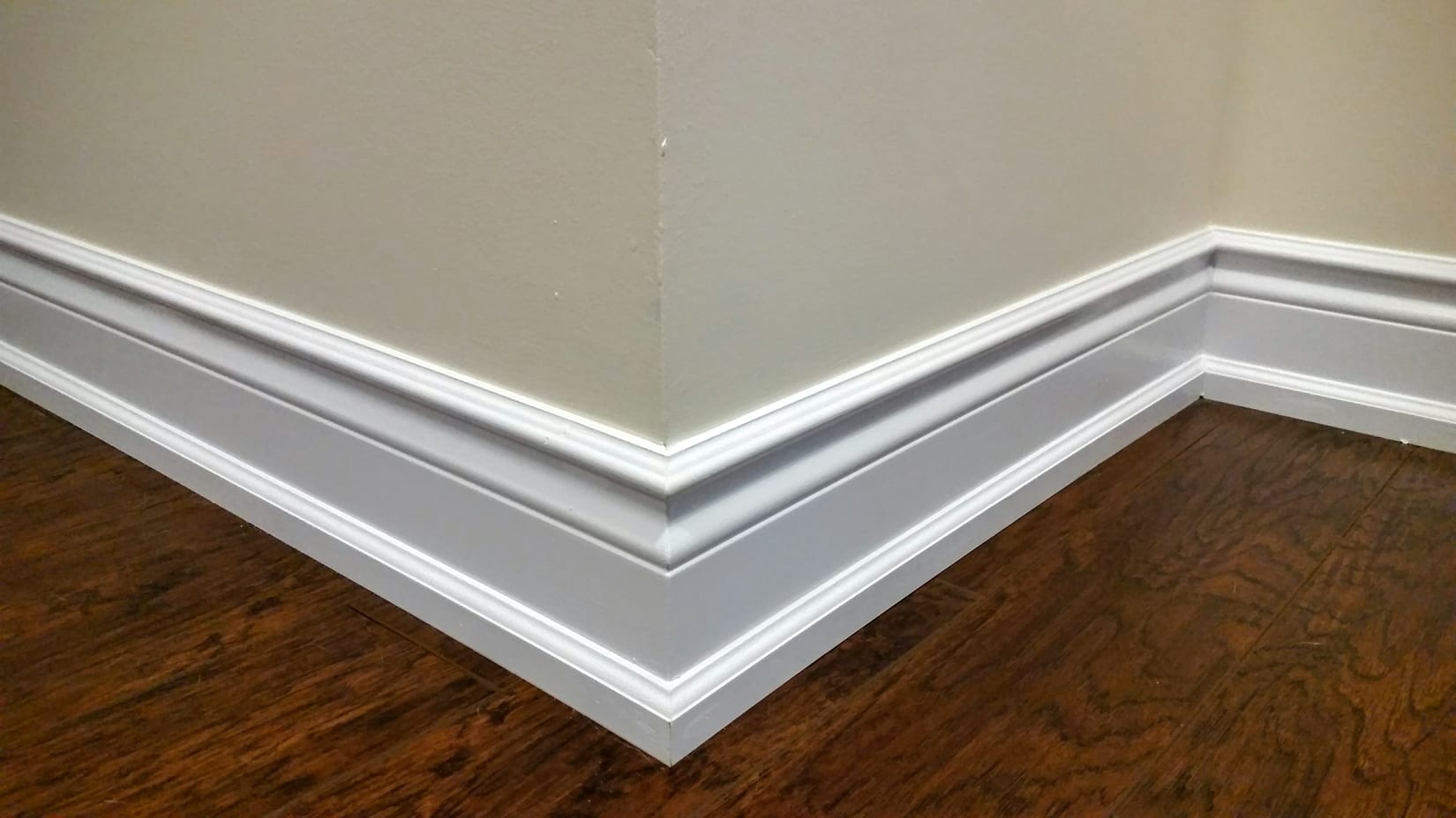Tall baseboard with cap and shoe moulding at a Mississauga outside corner
