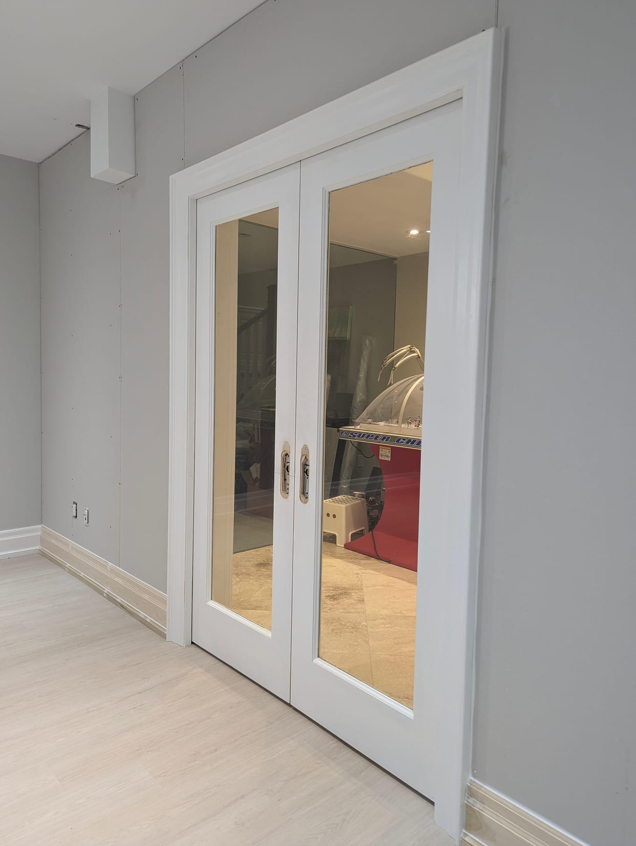 Double glass doors and casing during installation in an Oakville home
