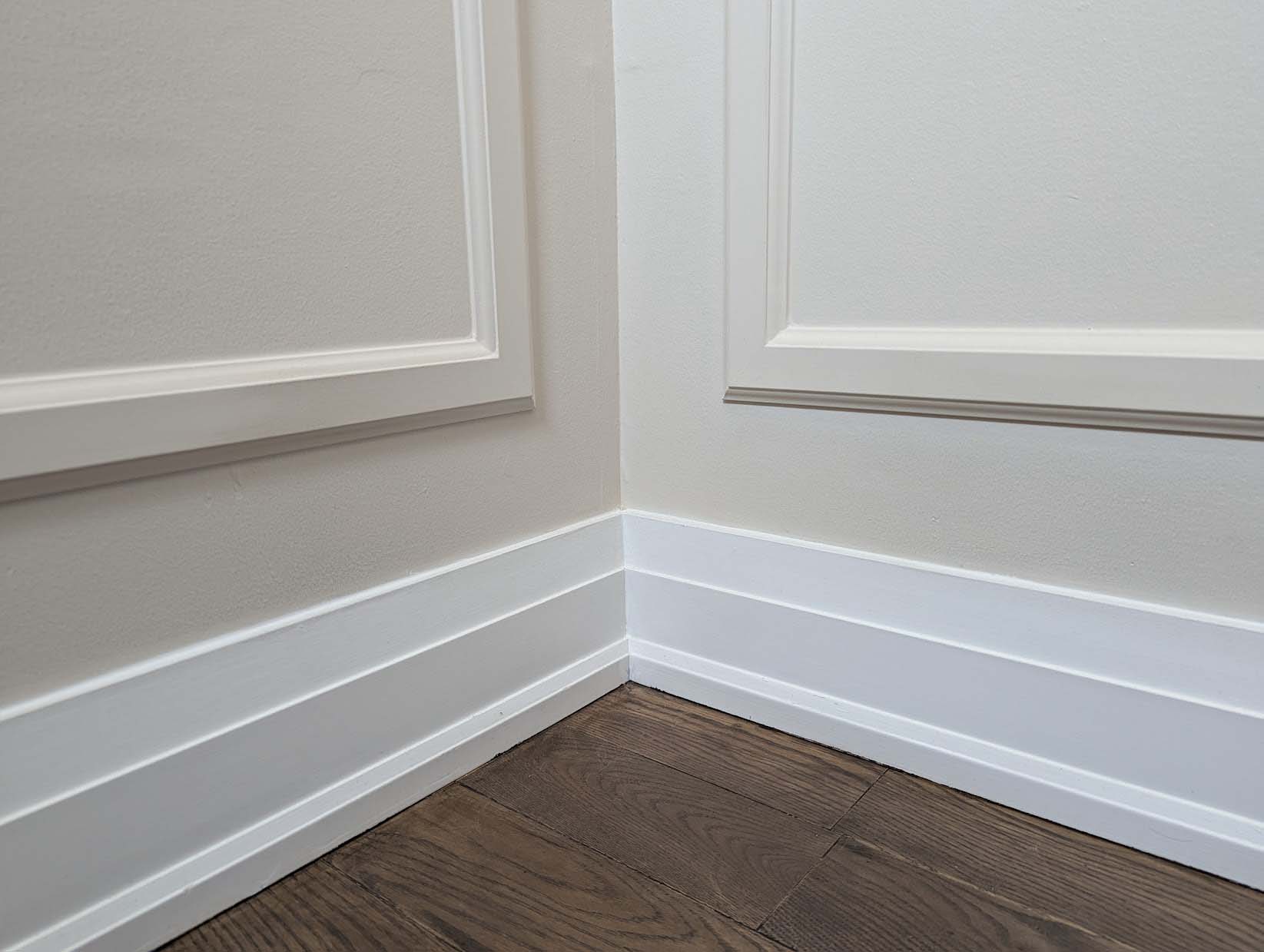 Baseboard corner detail with mitred joint — precision finish carpentry Toronto