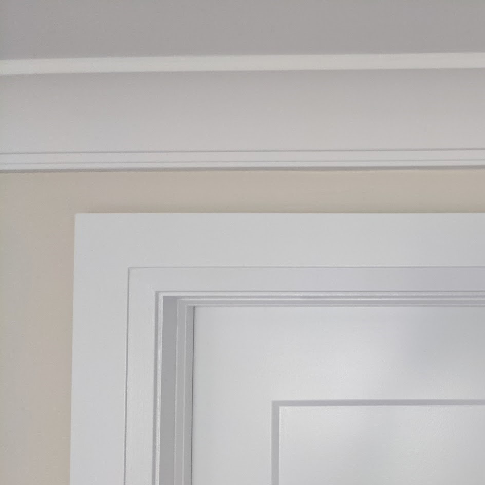 Door casing with crisp mitred corners — Richmond Hill trim installation