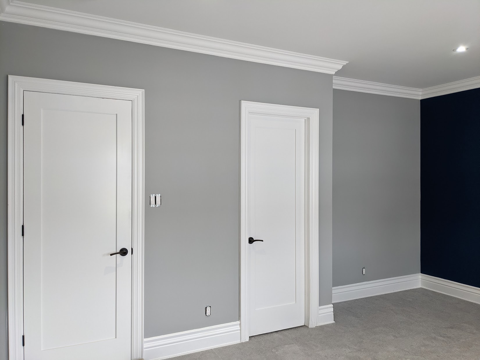 Full trim package installed in Aurora custom home — baseboards, casings, crown