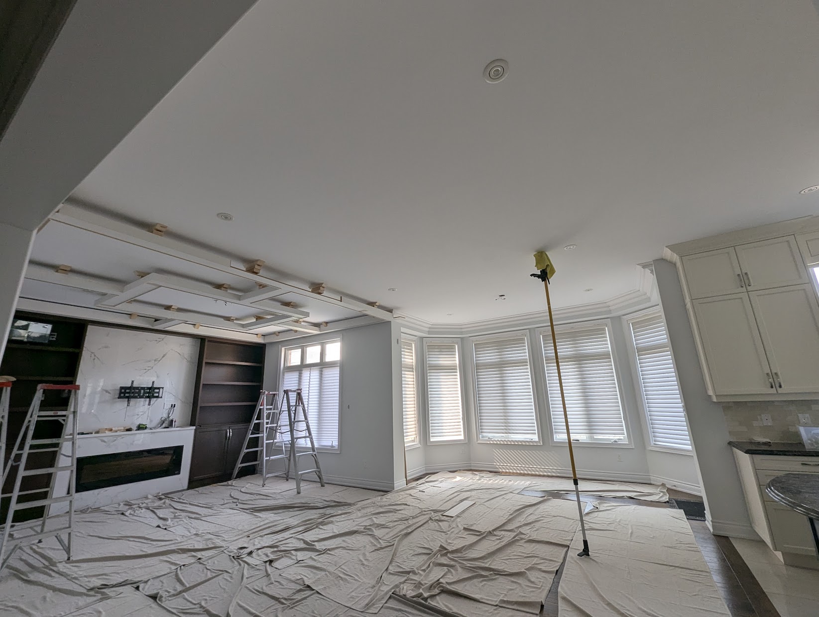 Expert Crown Moulding custom-building waffle ceiling sections on site Toronto